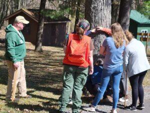 Envirothon team members listen to Forestry Board instructors explain about trees. 2023 Envirothon training day.