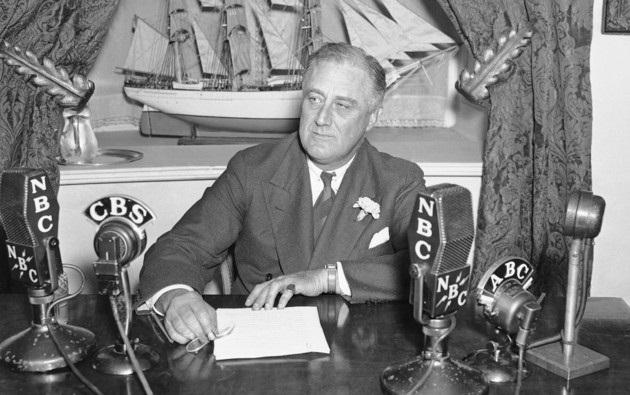 Franklin D Roosevelt in front of many television microphones