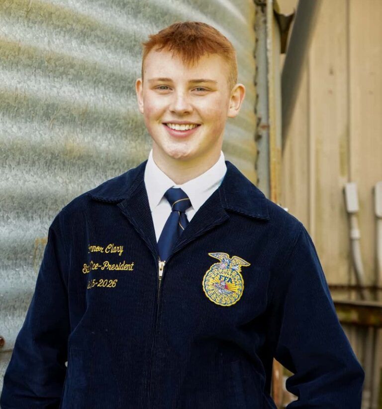Connor Clary wearing his dark blue FFA coat